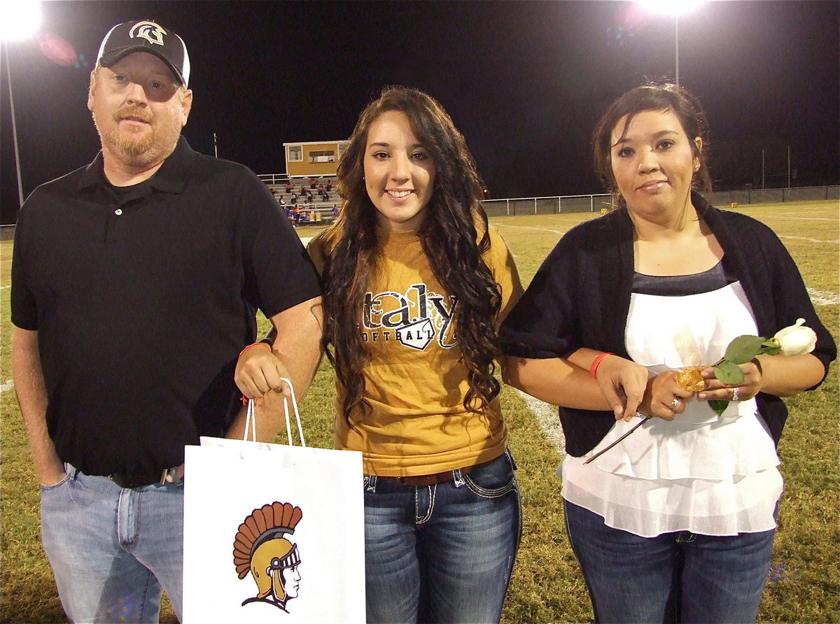 Image: Senior Lady Gladiator Alyssa Richards is escorted by her parents Allen and Tina Richards. Alyssa will be attending Tennessee Tech University on a softball scholarship and become a softball coach and teacher, just like mom. Her most memorable moment in athletics was the 2011 softball playoff run when her team hit 5 homeruns in one game.