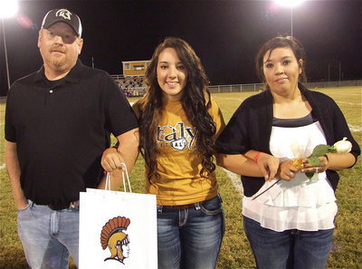 Image: Senior Lady Gladiator Alyssa Richards is escorted by her parents Allen and Tina Richards. Alyssa will be attending Tennessee Tech University on a softball scholarship and become a softball coach and teacher, just like mom. Her most memorable moment in athletics was the 2011 softball playoff run when her team hit 5 homeruns in one game.