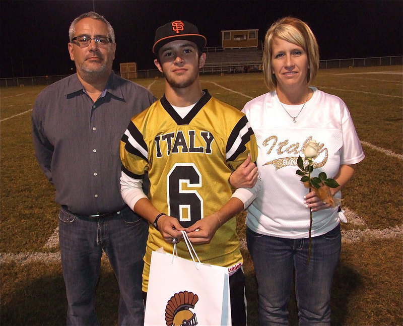 Image: Senior Gladiator Caden Jacinto(6) is escorted by his parents Vincent and Lisa Jacinto. Caden will attend junior college where he can pursue his dream to play baseball at the next level before eventually becoming a business owner in the custom millwork industry. His most memorable moment in athletics was during the 2011-12 varsity basketball season at home against Clifton when he made six 3-point shots and had 24 total points.