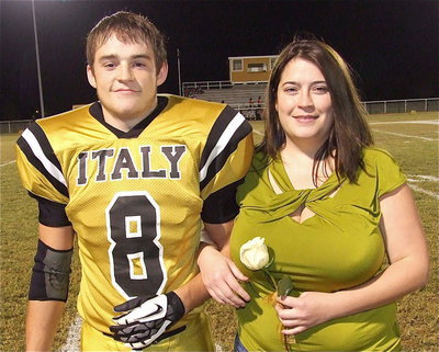 Image: Senior Gladiator Hayden Woods(8) is escorted by his sister, Mistiann Antunez. Hayden’s goals after graduation are to attend the Navarro Police Academy in Corsicana and become a Dallas Police Officer. His most memorable moment in athletics was during power lifting when he needed help putting on his squat suit.