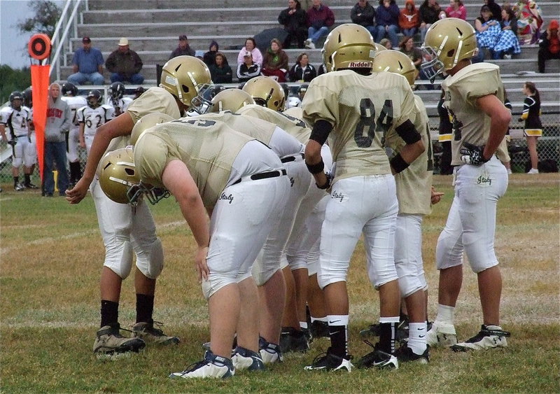 Image: Quarterback Devonteh Williams(9) calls the play to his offense.