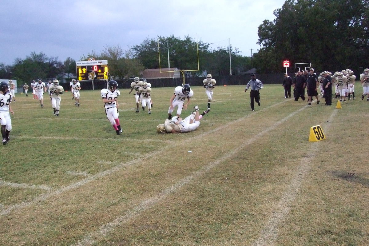 Image: IJH Gladiator Joe Celis(24) runs over a Cayuga tackler to end the first half with Italy leading 6-0.