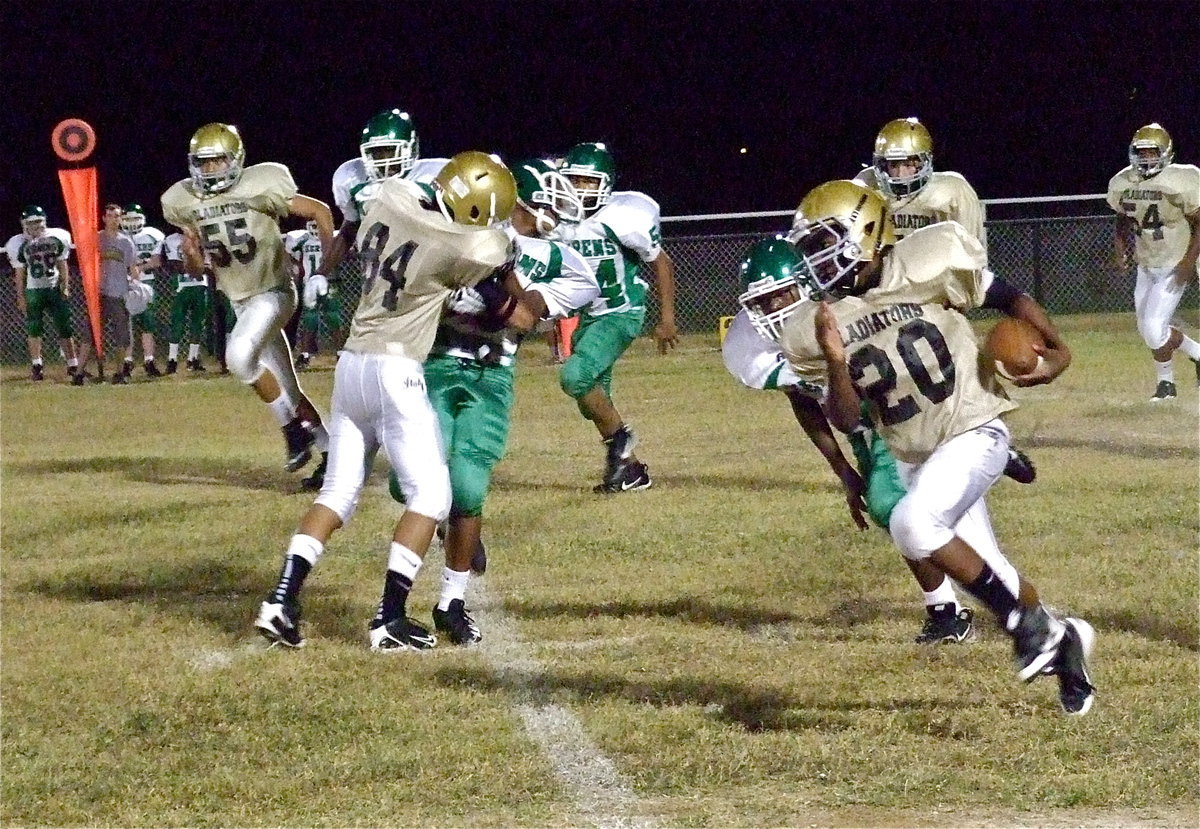 Image: Receiver Fabian Cortez(84) earholes an unsuspecting Bobcat defender to give teammate Kendrick Norwood(20) the sideline who then races 45-yards for a touchdown.
