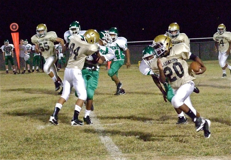 Image: Receiver Fabian Cortez(84) earholes an unsuspecting Bobcat defender to give teammate Kendrick Norwood(20) the sideline who then races 45-yards for a touchdown.