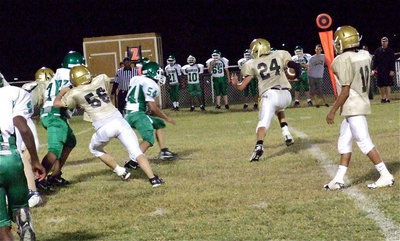 Image: Tylan Wallace(10) hands off to Joe Celis(24) who looks for room to run after a block from Elliott Worsham(56).