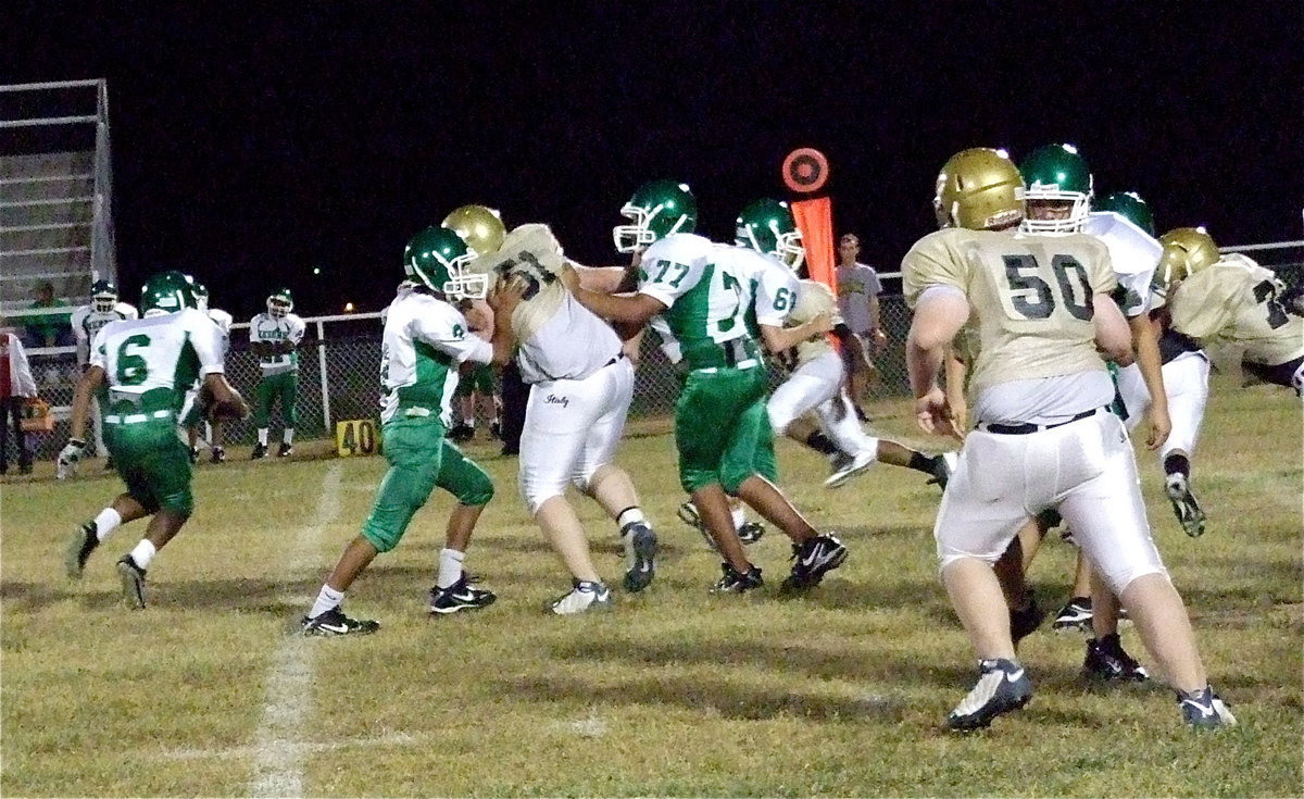 Image: Italy’s Austin Pittmon(51) and Aaron Pittmon(50) have a Bobcat on the run.