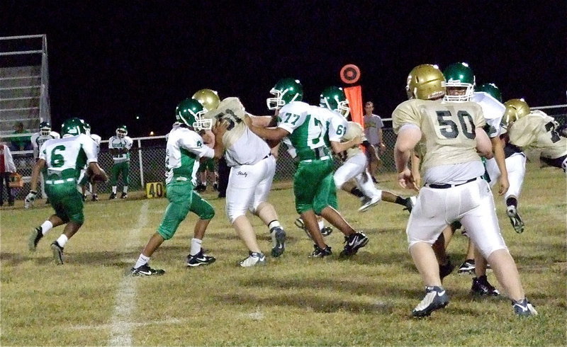 Image: Italy’s Austin Pittmon(51) and Aaron Pittmon(50) have a Bobcat on the run.
