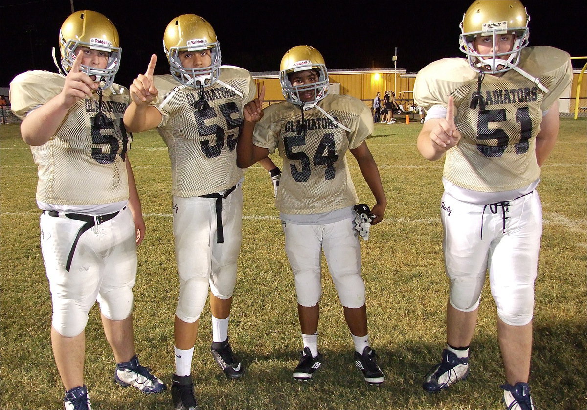 Image: Aaron Pittmon(50), David De La Hoya(55), Kenneth Norwood, Jr.(54) and Austin Pittman(51) are proud of their Italy Junior High Gladiator squad after Italy defeated Kerens 38-30 in a barn burner at Willis Field.