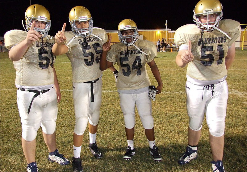 Image: Aaron Pittmon(50), David De La Hoya(55), Kenneth Norwood, Jr.(54) and Austin Pittman(51) are proud of their Italy Junior High Gladiator squad after Italy defeated Kerens 38-30 in a barn burner at Willis Field.