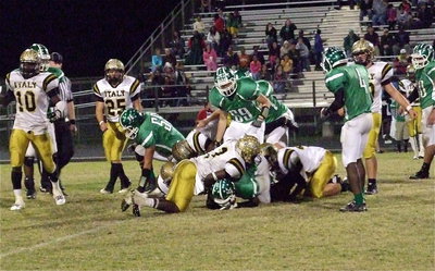 Image: Ryheem Walker(10), Shad Newman(25), Marvin Cox(3) and Reid Jacinto(11) keep the Bobcat offense penned down.
