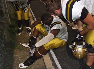 Image: Overcome. Gladiator senior Adrian Reed(64) celebrates with fans and family after Italy’s win but then sits down after being overwhelmed with his team’s accomplishment, claiming the 2012 District 6-1A District Championship!