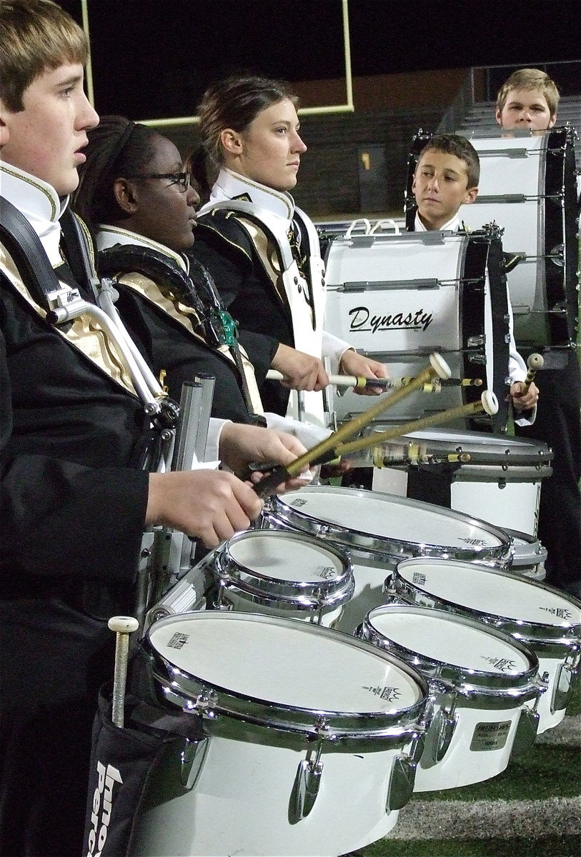 Image: Drumline members Brett Kirton, Brenya Williams, Whitney Wolaver, Noah Ramirez and Gus Allen are on top of their game during the halftime performance.