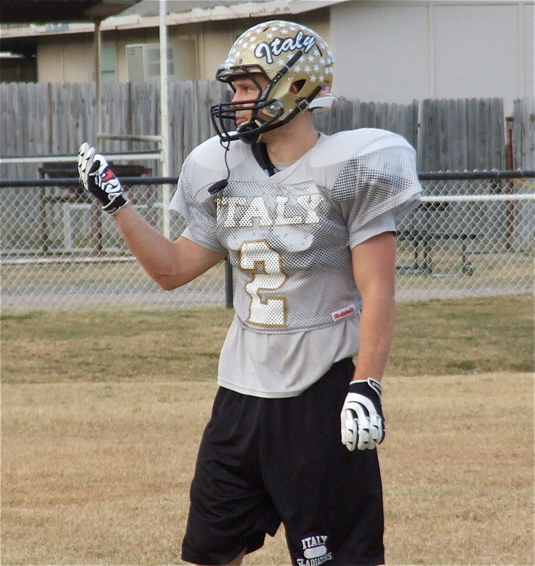 Image: Chase Hamilton(2) summons his fellow secondary defenders into pass coverage.