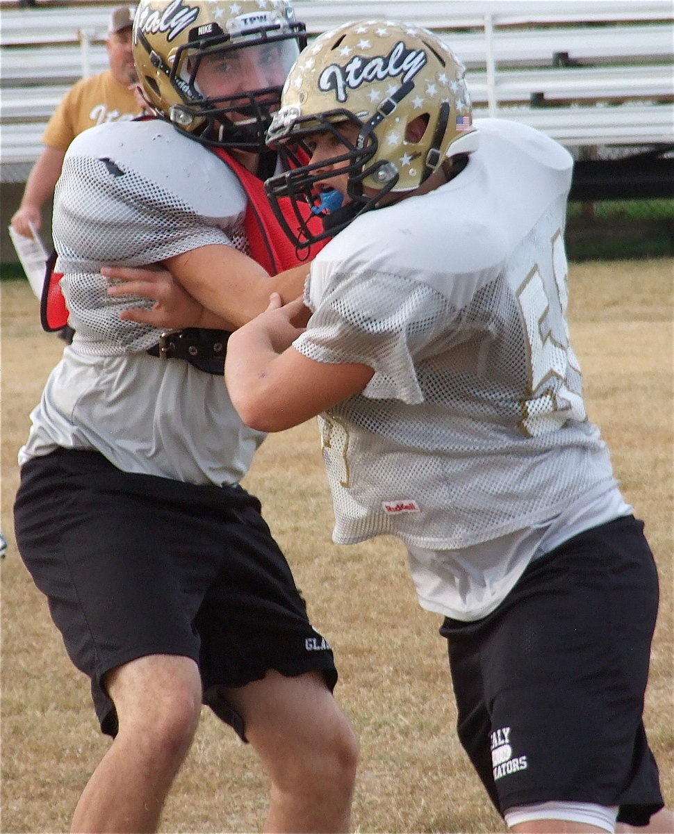 Image: Zackery Boykin blocks against Zain Byers.
