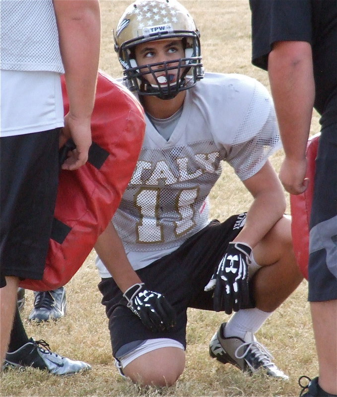 Image: Reid Jacinto gets advice from his coach.