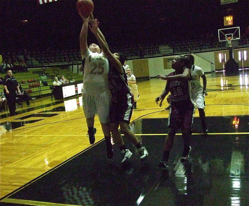 Image: The relentless Monserrat Figueroa(25) is to strong for Faith Family defenders in the lane.