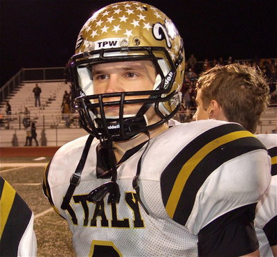 Image: Senior hitman Chase Hamilton(2) respects Honey Grove’s playing of this school song after Italy’s 33-20 win.