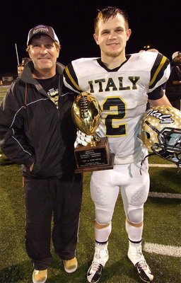 Image: Proud pop: Lee Hamilton with his son, Chase Hamilton(2), as they pose with the regional semifinal championship trophy.