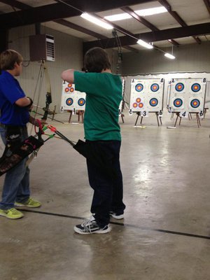 Image: Austin Sillivan takes aim to win his intermediate division.
