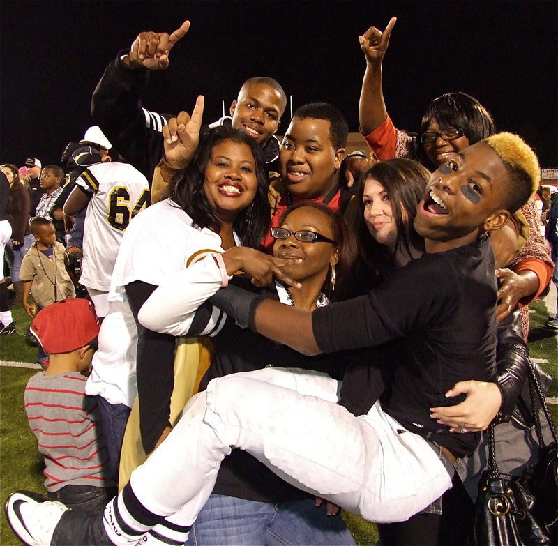 Image: Oh Happy Days! Gladiator WR/DB Eric Carson(12) leaps into his families arms after Italy 14-3 quarterfinal championship win over Goldthwaite!!