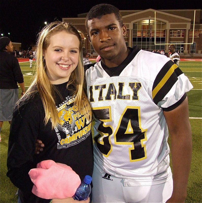 Image: Tia Russell congratulates Justin Robbins(54) after Italy’s playoff win over Goldthwaite.