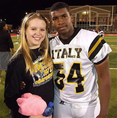 Image: Tia Russell congratulates Justin Robbins(54) after Italy’s playoff win over Goldthwaite.