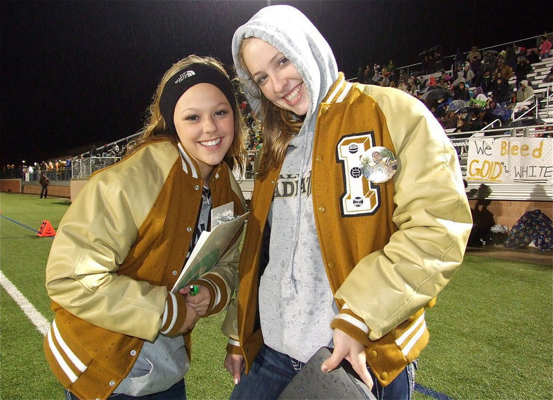 Image: Stat girls Bailey Eubank and Jaclynn Lewis keep their spirits up.