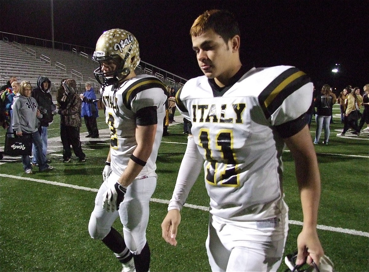 Image: Senior Gladiators Chase Hamilton(2) and Reid Jacinto(11) take those difficult last steps back to the locker room with Italy’s amazing run ending in Mineral Wells with the Stamford Bulldogs getting the 41-8 win to advance to the state championship against the Mart Panthers.