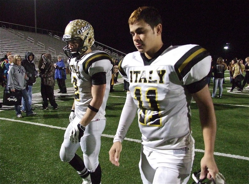 Image: Senior Gladiators Chase Hamilton(2) and Reid Jacinto(11) take those difficult last steps back to the locker room with Italy’s amazing run ending in Mineral Wells with the Stamford Bulldogs getting the 41-8 win to advance to the state championship against the Mart Panthers.