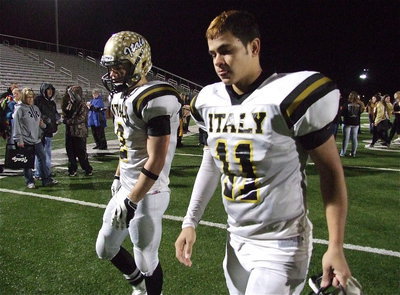 Image: Senior Gladiators Chase Hamilton(2) and Reid Jacinto(11) take those difficult last steps back to the locker room with Italy’s amazing run ending in Mineral Wells with the Stamford Bulldogs getting the 41-8 win to advance to the state championship against the Mart Panthers.