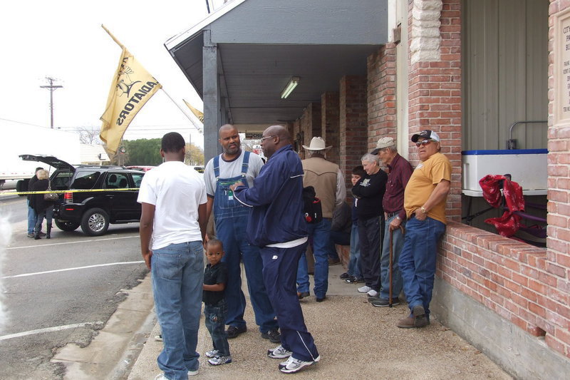 Image: Festival goers gather in front of the pavilion to relax and swap stories.