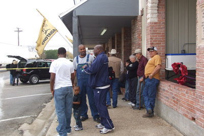 Image: Festival goers gather in front of the pavilion to relax and swap stories.