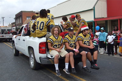 Image: Tailgating Gladiators Shad Newman, Zain Byers and Kevin Roldan enjoy the parade along with teammates Justin Robbins, Hayden Woods, Darol Mayberry, Levi McBride, Ryheem Walker, Hunter Merimon, Jalarnce Lewis and Reid Jacinto.