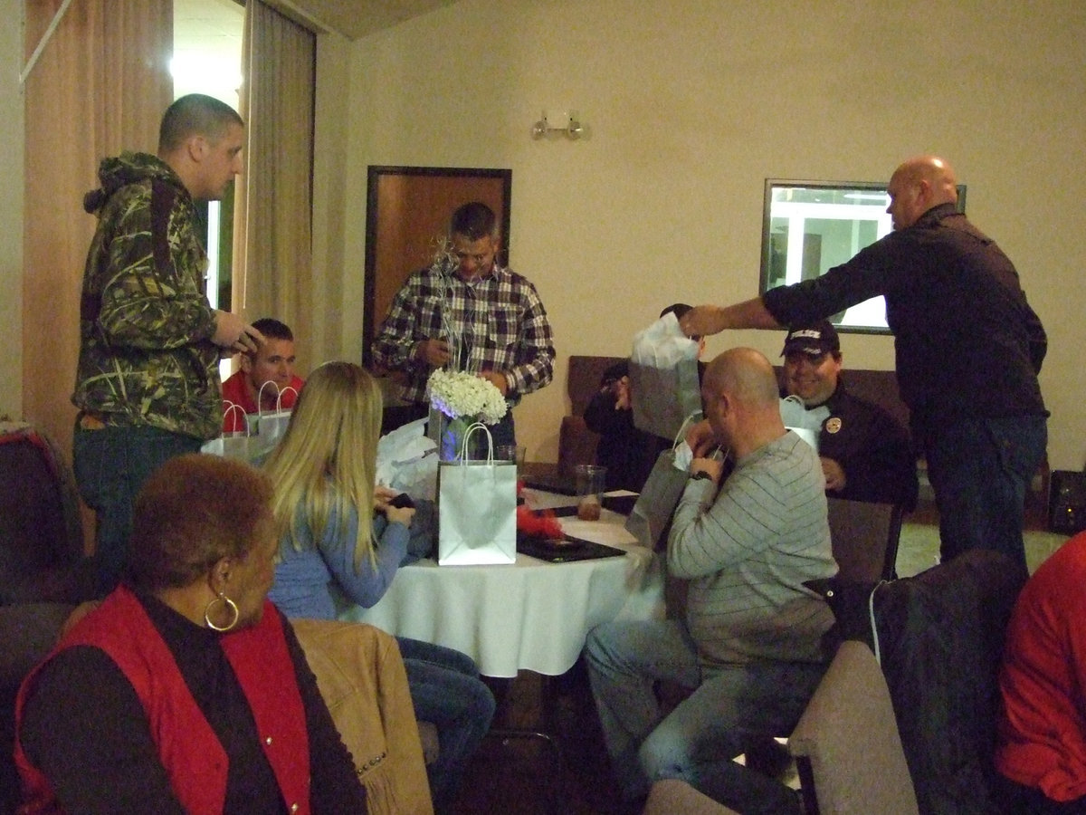 Image: Chief Hill presented gifts to the officers from he and his wife.
