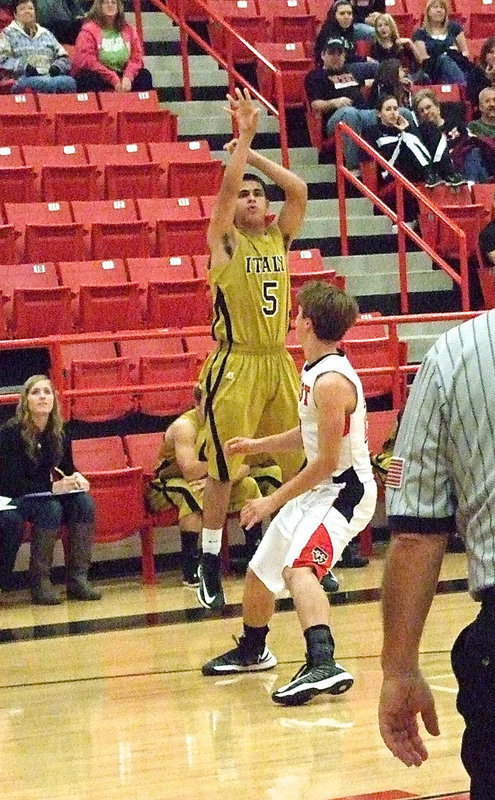 Image: Reid Jacinto(5) releases a three-ball over the West defense.