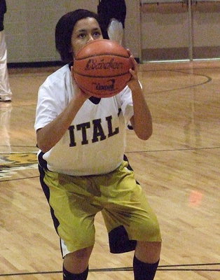 Image: Alex Minton concentrates from the foul line during pre-game hoops.