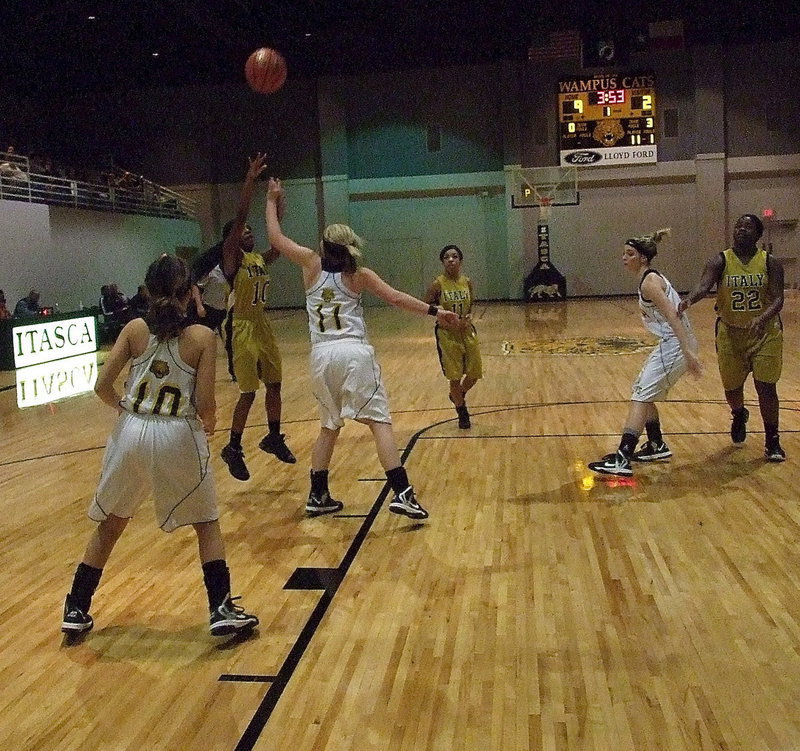 Image: Italy’s Kendra Copleand(10) pulls up for a jumper over a Lady Cat defender.