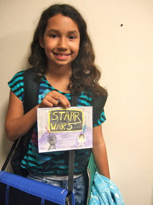 Image: Karman Lawson with her STAAR Wars art design.