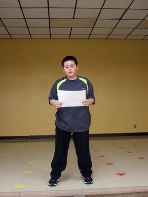 Image: Rocklin Ginnett reciting his poem entitled Gladiators.