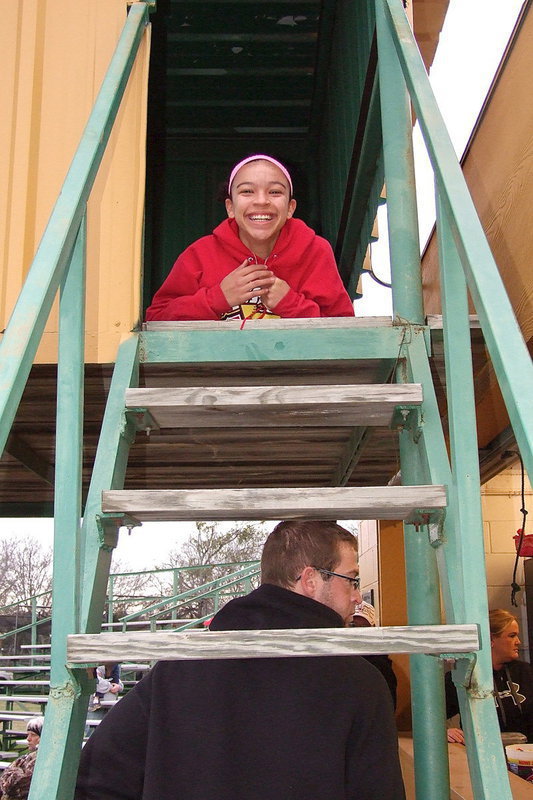 Image: Manager April Lusk takes a break from the clock to annoy the unsuspecting Coach Nate Skelton.