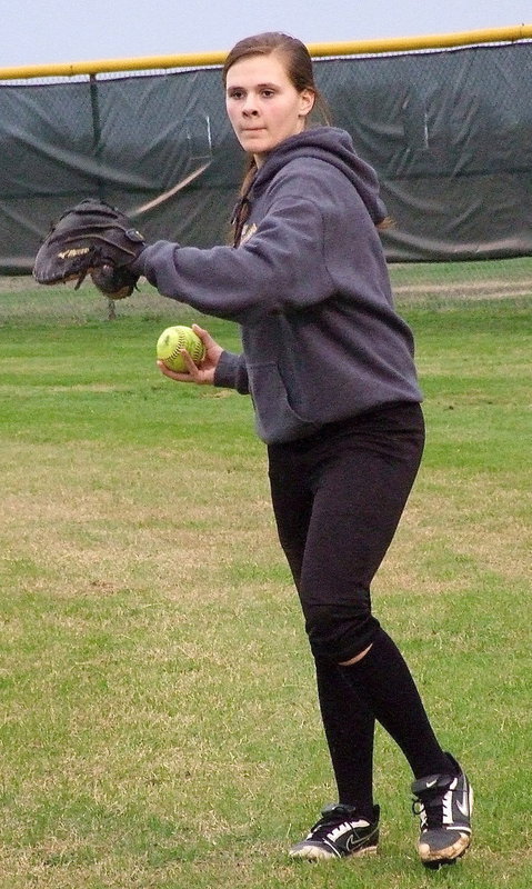 Image: Freshman Lillie Perry is getting warmed up for the varsity game.