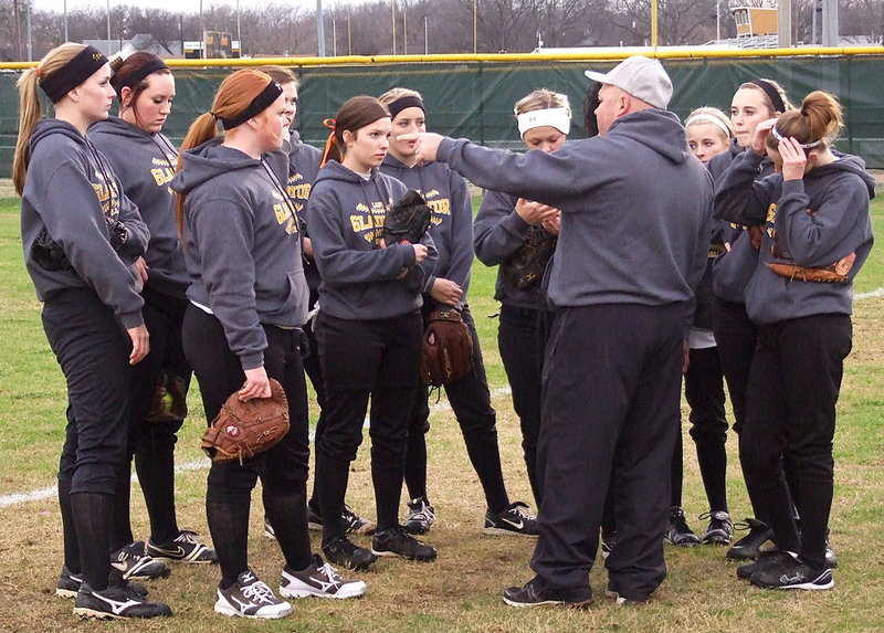 Image: Head Coach Wayne Rowe directs the squad before taking the field.