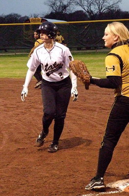 Image: Madison Washington(2) looks for a chance to steal second-base.