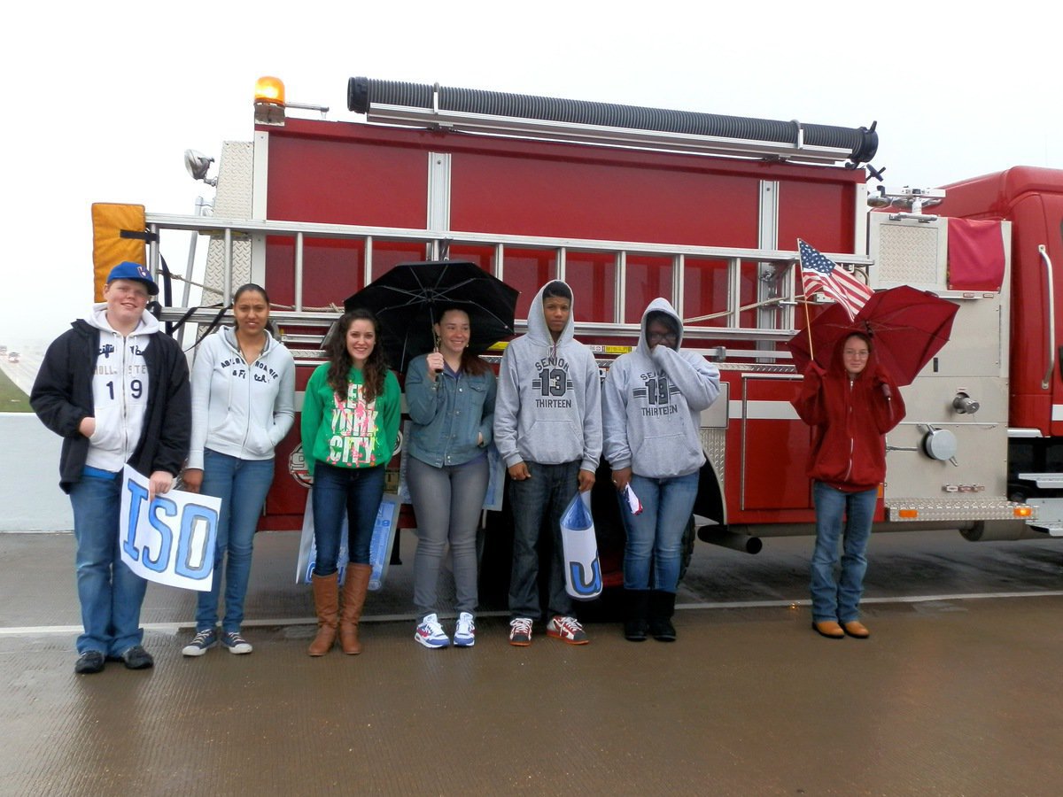 Image: Milford High School students join the Italy and Milford Fire Departments atop the Dale Acres overpass to honor fallen war hero Chris Kyle.