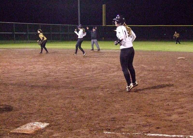 Image: Madison Washington and Jaclynn Lewis have to rein it in after a foul ball impedes their progress against Hubbard.