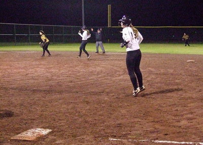 Image: Madison Washington and Jaclynn Lewis have to rein it in after a foul ball impedes their progress against Hubbard.