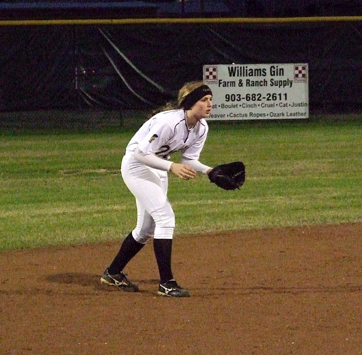 Image: Shortstop Madison Washington(2) closes in on a Lady Wildcat batter.