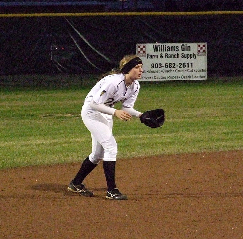 Image: Shortstop Madison Washington(2) closes in on a Lady Wildcat batter.