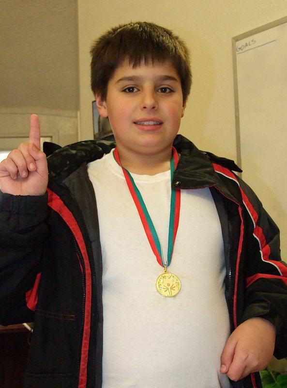 Image: Practice and hard work paid off as Stafford Elementary’s Mikey South made use of the basketball goal standing in his driveway to eventually stand atop the championship podium in Cedar Hill to receive his 1st place gold medal after posting the fastest time in the 10 meter dribbling race with a 3.8 second victory in his heat. Parents Michael and Tessa South were on hand to share the exciting moment with the champ.
