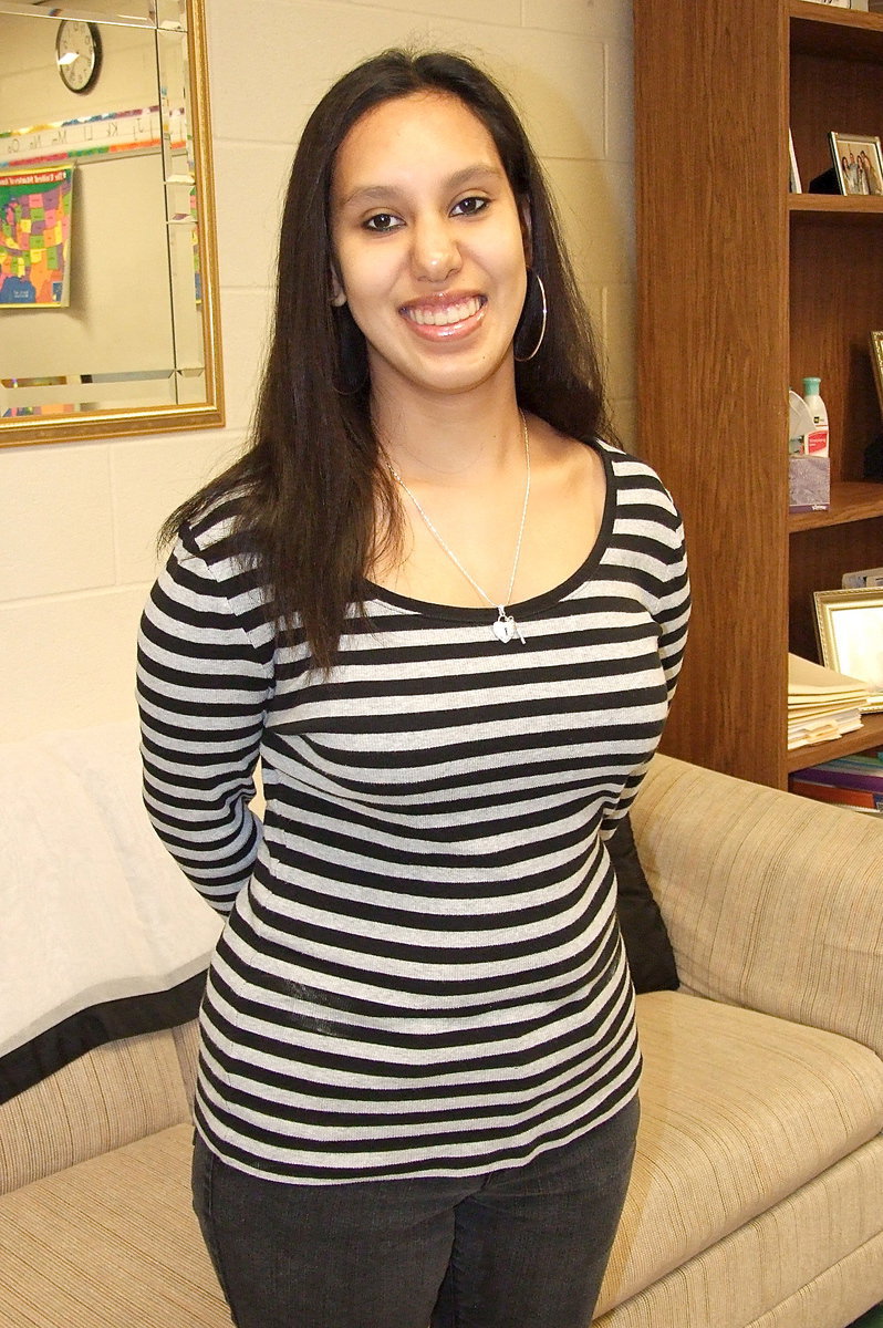 Image: CBI class member Morgan Martinez is professionally dressed for work where she spends half her days at the Happy Heart Day Care facility in Italy.
